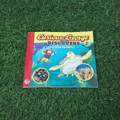 Curious George discovers the ocean - Average Condition Paperback
